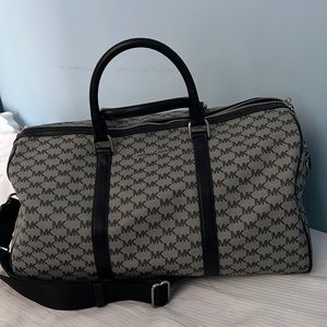 Michael Kors Lg Weekender Duffel Black and gray with silver hardware. New